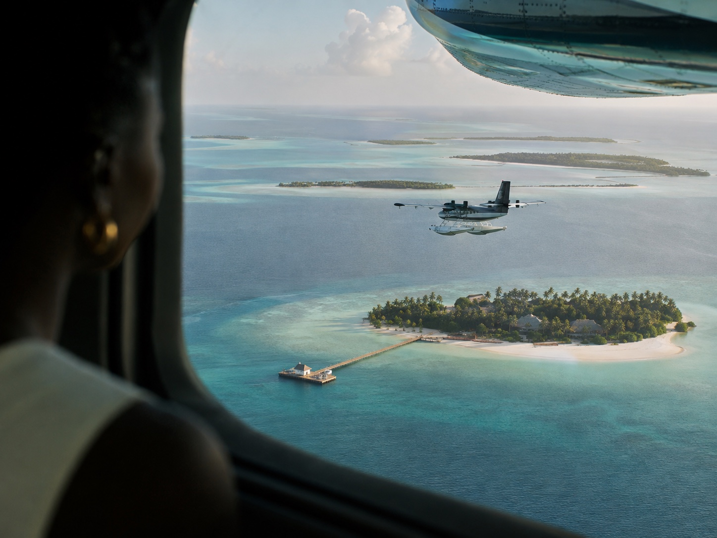 A seaplane approaching a Maldives island
